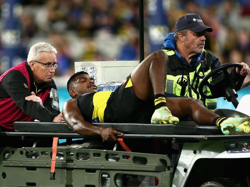 Tigers' Maurice Rioli Jnr being taken off the MCG after suffering his injury against the Bulldogs. (Rob Prezioso/AAP PHOTOS)
