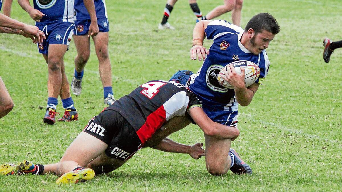 • Bullpup Wayde Aitken gets brought down by a Cooma Colt defender during Saturday's clash at Bemboka. 