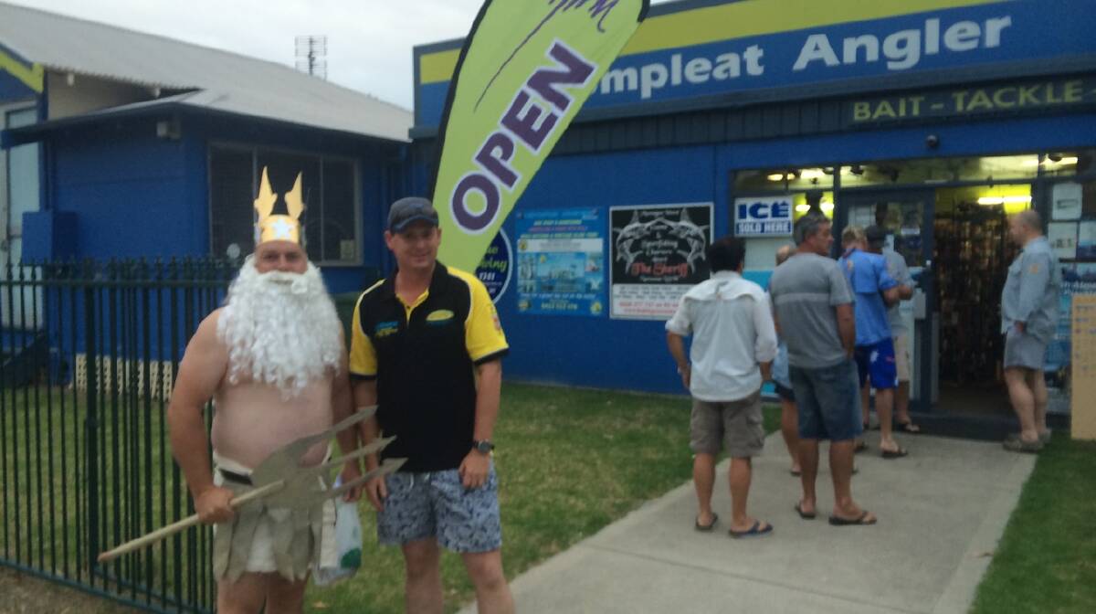 
KING NEPTUNE: Best -presented fisherman Mr Maz as King Neptune outside the Narooma Ocean Hut Compleat Angler with his teammate Rob Sinclair from Oberon.
