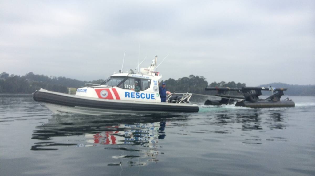 WATER WAY: Marine Rescue Narooma was spotted moving its pontoon across Wagonga Inlet on Saturday.