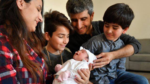 'She's going to be an Aussie': Week-old Melbourne-born baby Onita and her family from Iraq, father Faris Sora, mother Diana Shaheen and brothers Martin, 10, and Noorseen, 6, are grateful for their new life in Australia.  Photo: Joe Armao