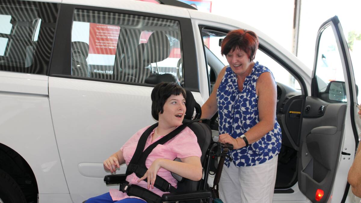 Colleen and Janelle Barrett look at their new fully converted disability access Kia Carnival which they took delivery of at Tarra Ford on Monday. 