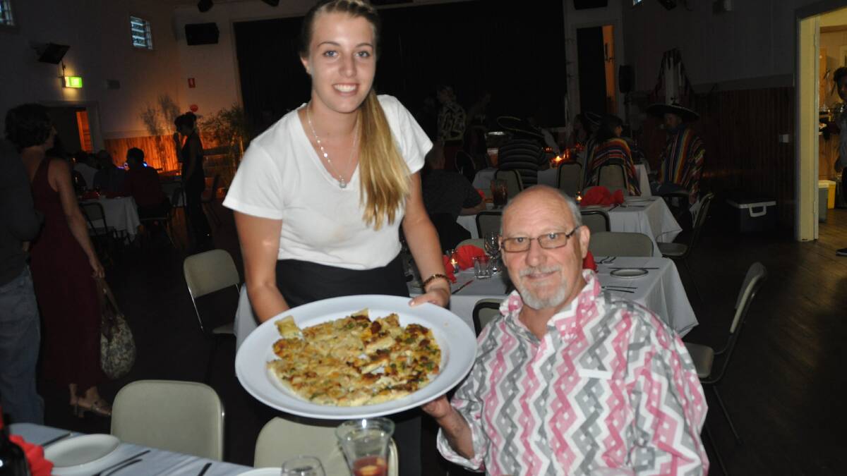 Tayla Grant offered Steve Kite a taste of authentic food. 