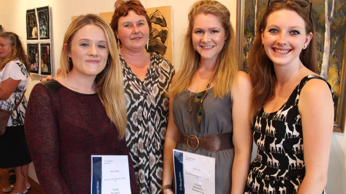 International Women's Day scholarship winners Mikayla Larkham and Kieran Hay (with certificates) are congratulated by BVSC's Emma Benton and last year's recipient Siobhan Linehan. 