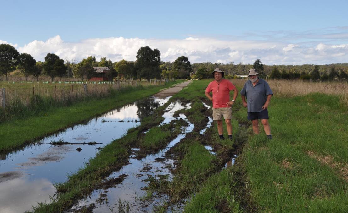 Panboola volunteers Grant Stevenson, left and Ray Anderson at the site of the 4WD vandalism at Panboola Wetlands. 