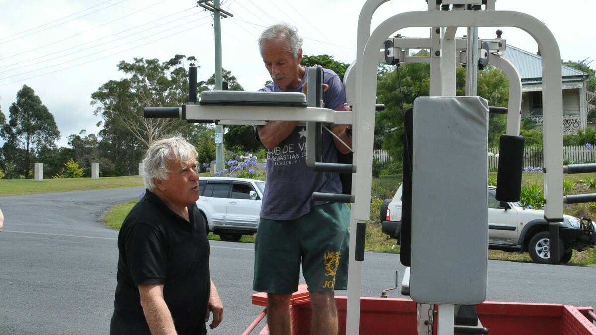 John Liston, left and Mick Brosnan who have been closely involved with the Samaritan Shop, inspecting a workout bench and combined weights that was donated to the shop.