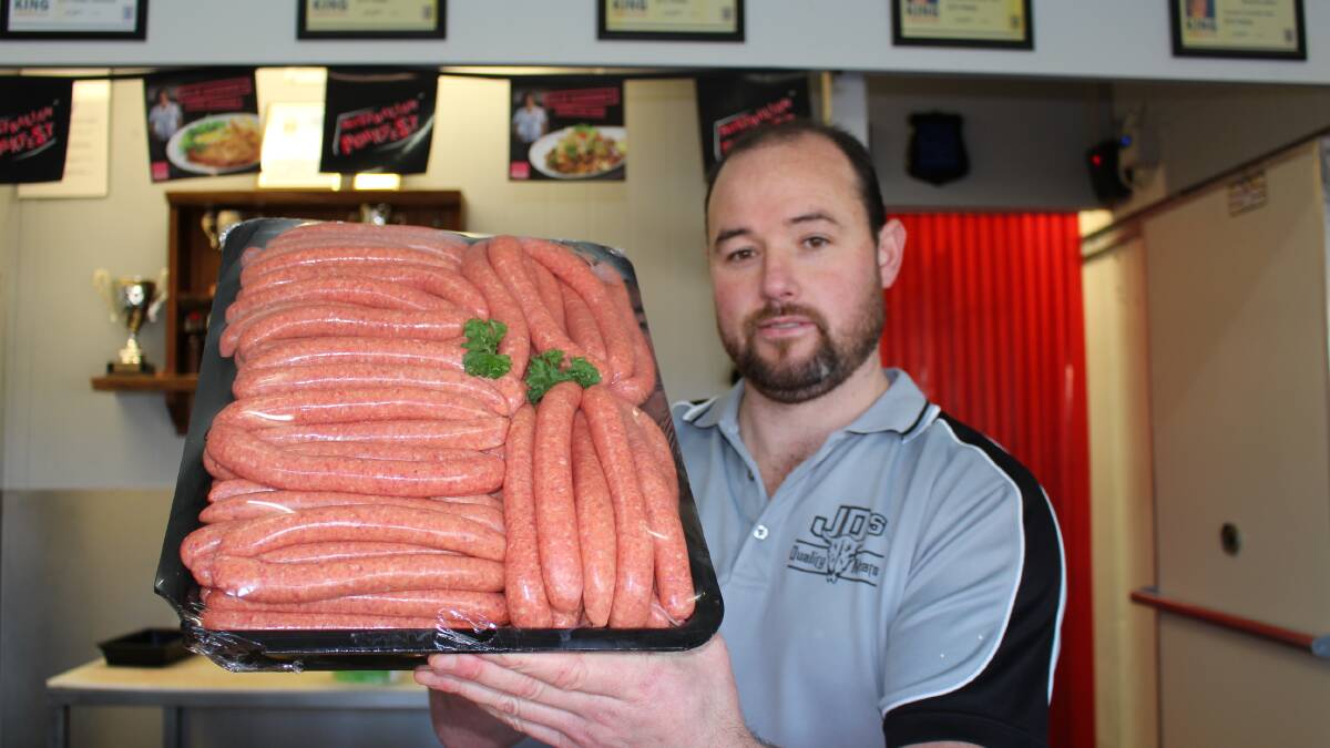 Jamie Parkes, of JD's Meats, Pambula holds up a tray of his prize-winning beef sausages which took out first prize in this year’s Australian Meat Industry Council NSW/ACT Sausage King and Best Butchers Burger Far South Coast Competitions.  