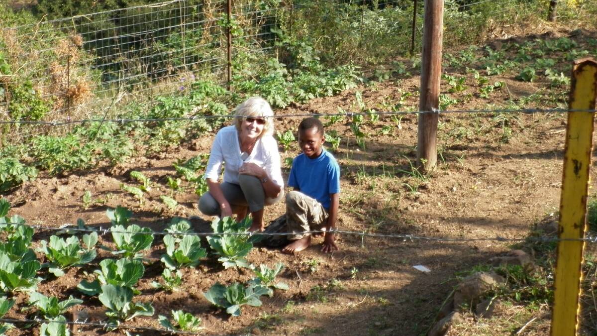 Libby Weir, of Pambula Beach, in one of the many newly established vegetable gardens. 