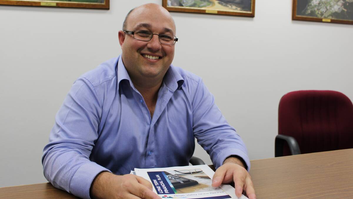 Lucas Scarpin, council’s finance manager with the draft budget documents for Bega Valley Shire Council. 