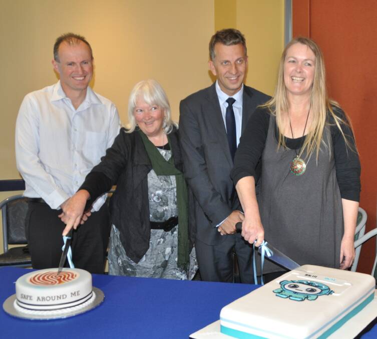 Liam O’Duibhir, left, of 2pi Software, joins in the official cake cutting with ‘Safe Around Me’, author Caroline Long, Member for Bega, Andrew Constance, and Kylie Furnell, SkillBot author.