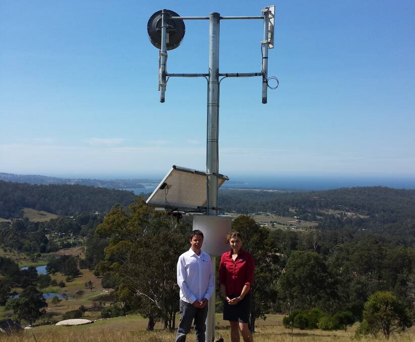 Pambula Beach couple, Paul McCooey and Lisa Dykes, of Splash Internet, in front of the new station at Bald Hills.