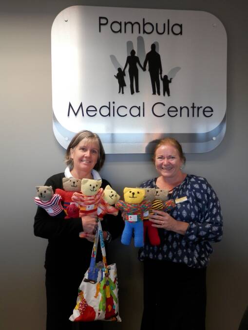 Immunisation nurse, Sian Morton and receptionist, Leesa Stewart with the knitted Red Cross teddy bears and toys donated by the Wolumla Red Cross members. 