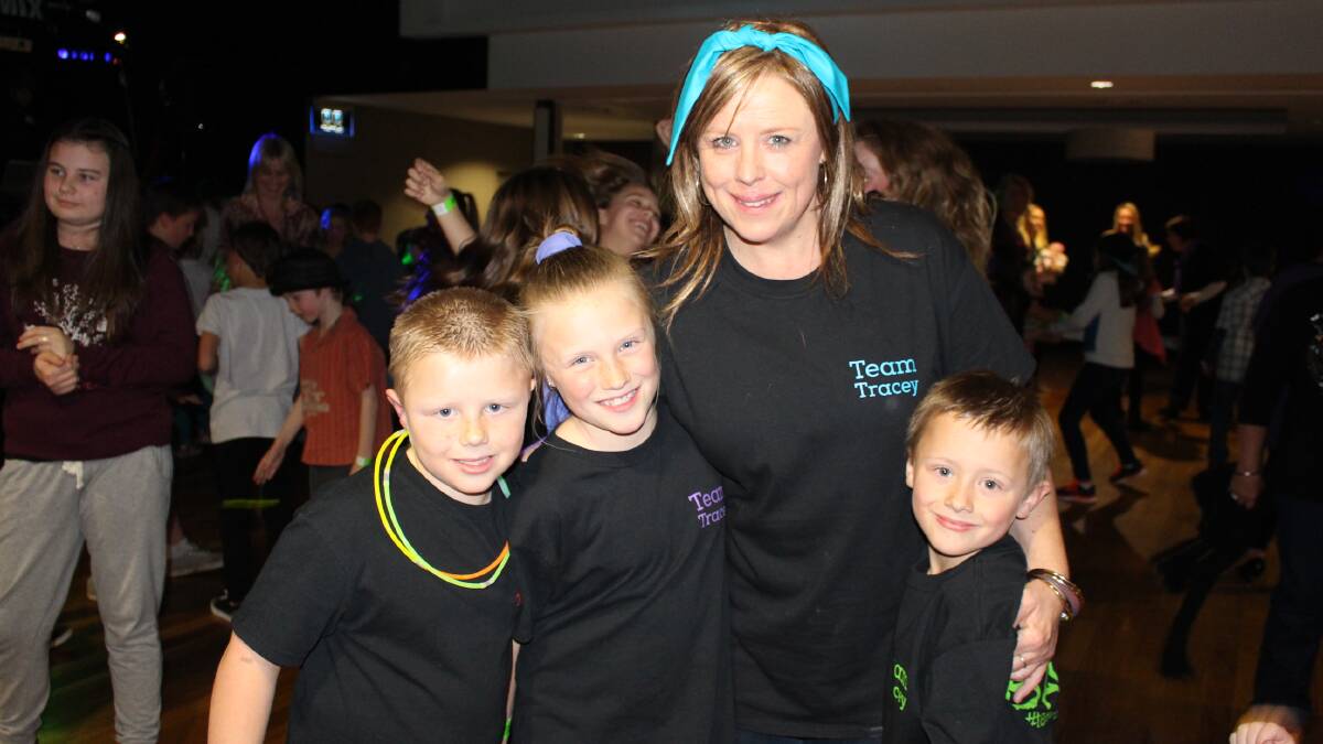 Tracey Beasley with her three children at the Team Tracey Kids Disco fundraiser recently. 