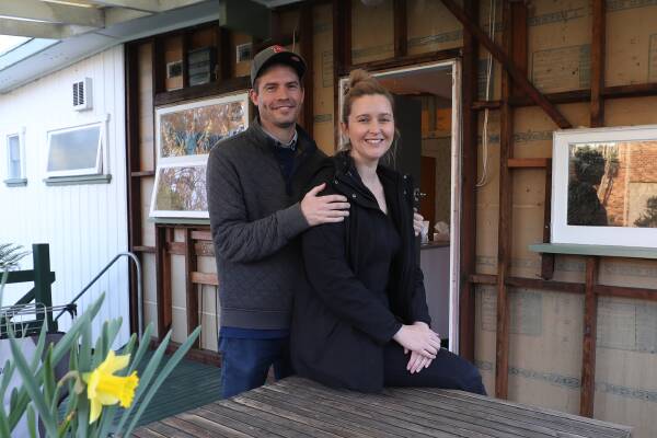 Nicholas Morphew and Hayley Rodd spent several months looking for a home to buy, before they purchased their "fixer-upper" in the Wollongong suburb of Unanderra. Picture by Robert Peet
