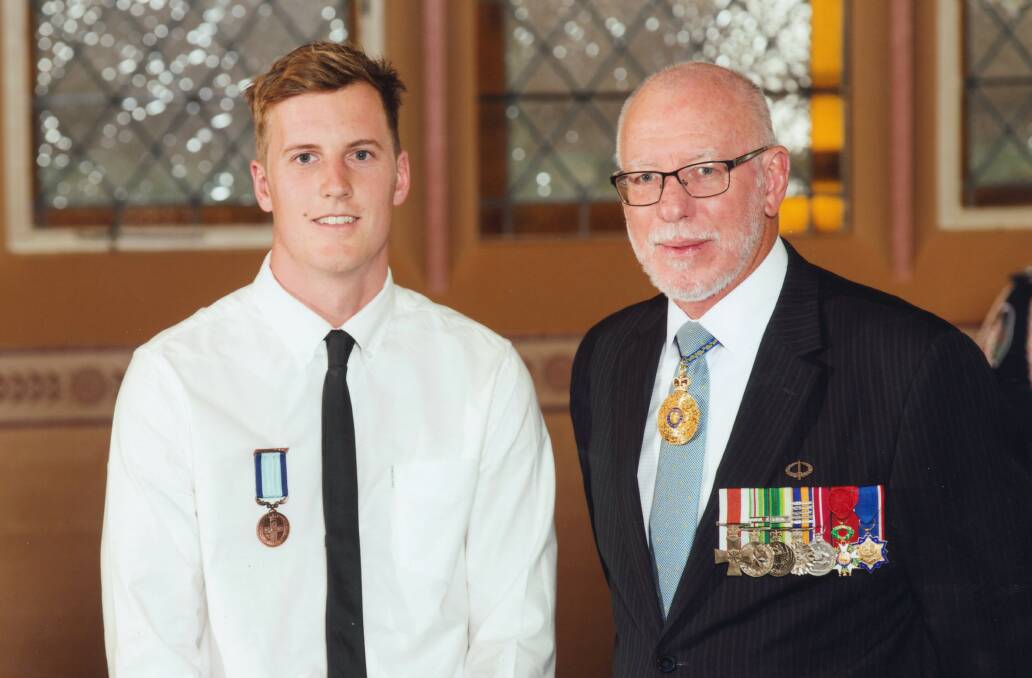 Deserved recognition: Merimbula's Steve Butterworth receives his bravery award from General David Hurley the Govenor of New South Wales. 