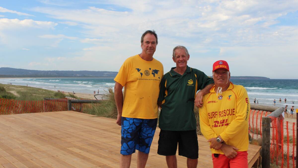 Victor Rothwell of Pambula Rotary with Pambula Surf Club life members Frank Davey and Don Hay who gave up many hours to built a new obersvation platform at Pambula Beach. 