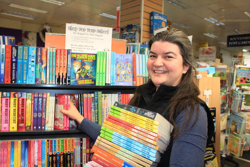 Books for bucks: Book manager at Collins Merimbula, Dennie Quintal is hoping to donate thousands of dollars to local schools. Picture: Melanie Leach
