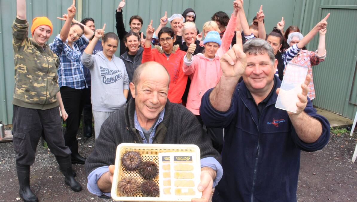 Number one: South Coast Sea Urchins owners Andrew Curtis and Keith Browne celebrate their delicious Produce Awards win with their staff. 