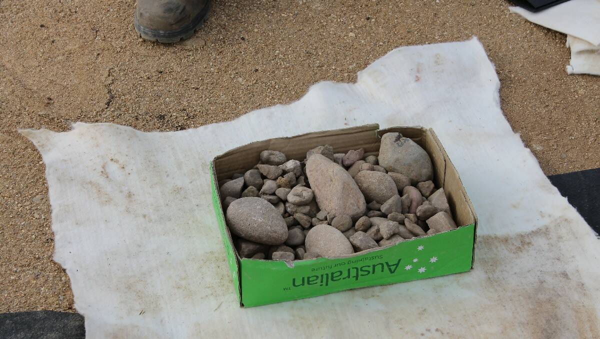 A sample of some of the sand-grounded rocks that are being used to form the landfill cell’s lining.