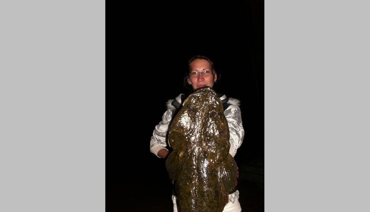 GIANT FLATHEAD: The giant dusky flathead caught by Ashleigh Clarke in the Narooma inlet last week fishing a pink Squidgy plastic and successfully released by Adam Babidge. 
