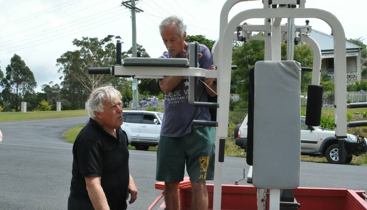 Samaritan Shop organisers and members of the Social Justice Advocates of the Sapphire Coast, John Liston, left and Mick Brosnan with the gym equipment that had been donated to the shop. 