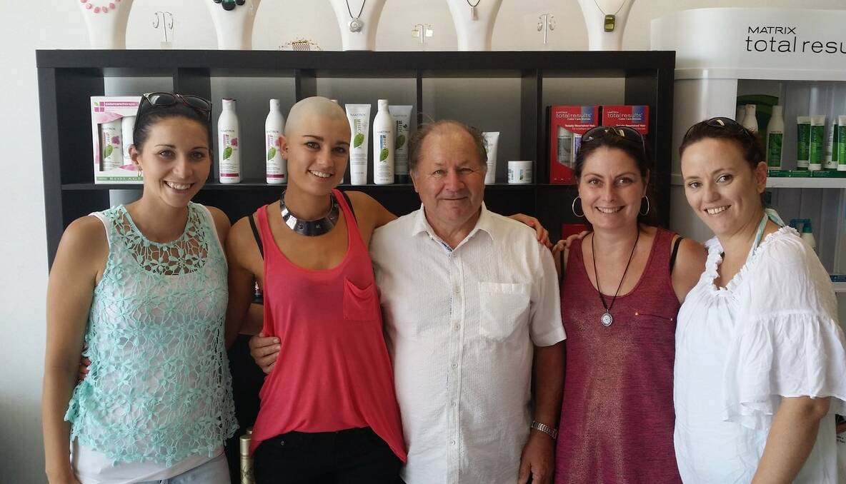 Kristy-Anne Rich with colleagues who supported her fundraising shave.