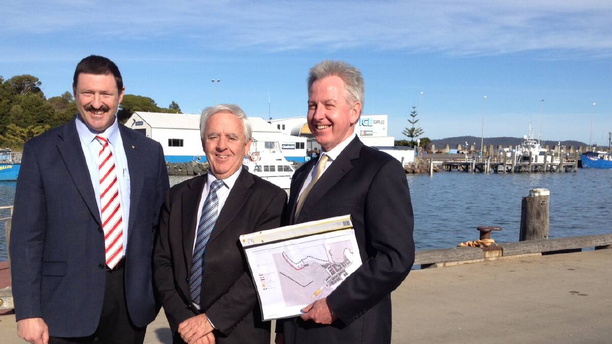 Member for Eden-Monaro, Dr Mike Kelly, left, Bega Valley Shire mayor, Bill Taylor and general manager, Peter Tegart at the Port of Eden on Tuesday, July 2.